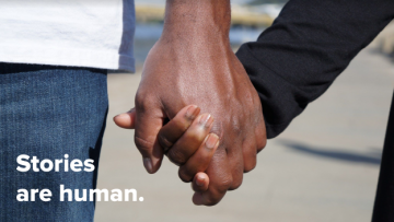 Two people holding hands with text that reads, "Stories are human."