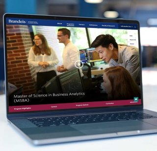 An example of a Brandeis International Business School landing page displayed on a laptop