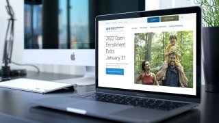 The Blue Cross Blue Shield of Vermont homepage displayed on a laptop