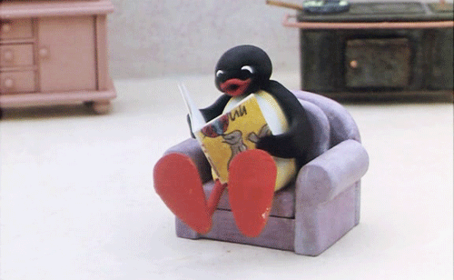 Penguin reading a book gif