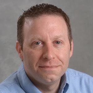 Headshot of Tim Nekritz, Director of News and Media, SUNY Oswego