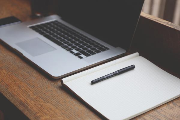 image of laptop and notebooks