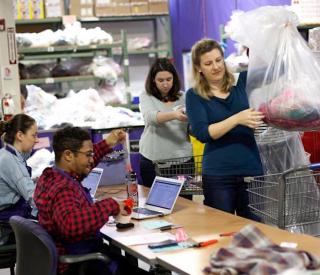 women sorting clothes