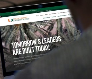 The Miami Herbert Business School homepage viewed on a laptop