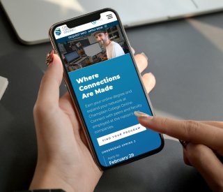 The Champlain College Online website displayed on a mobile device