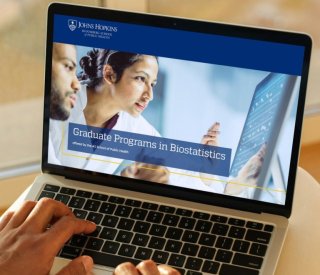 The Johns Hopkins University website displayed on a laptop