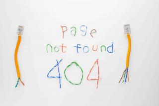 Ethernet cables aligned to spell out "page not found 404"