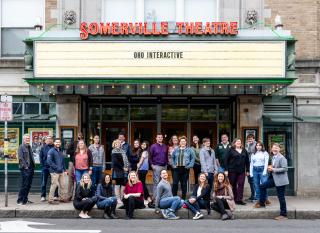 The OHO team sitting in front of the Somerville Theater
