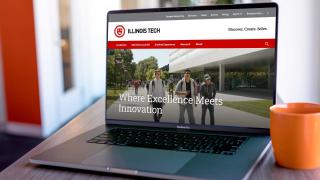 The Illinois Tech homepage displayed on a laptop