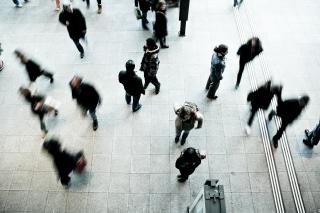 A top-down, blurry view of people walking on the street