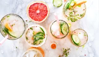 Several cocktails lined up on a table