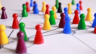 Multicolored game pieces on a game board