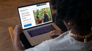 HealthInsurance_LeadGen_BCBSVT_1160x650(1).jpg A woman sits in a chair reviewing health insurance plans on her laptop