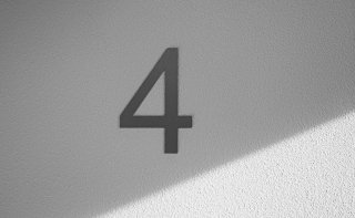 The number 4 on a grey background