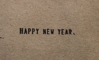 Happy New Year, displayed on a beige background