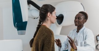 A doctor talks with a patient