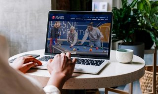 The Duquesne University website displayed on a laptop