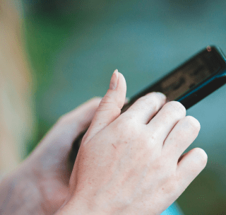 Hands holding a mobile device